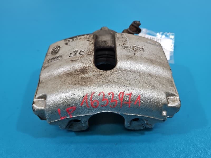 Zacisk przód lewy Vw Passat B7 2,0 tdi