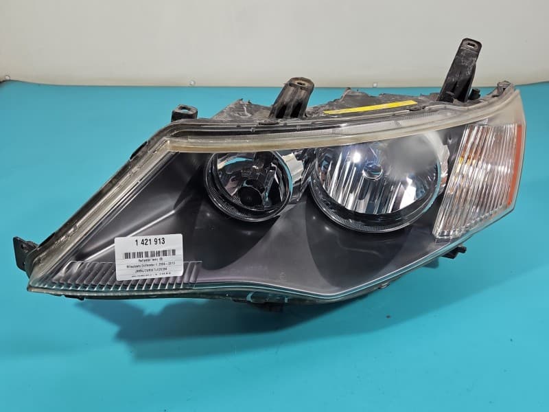 Reflektor lewy lampa przód Mitsubishi Outlander II 06-13 EUROPA