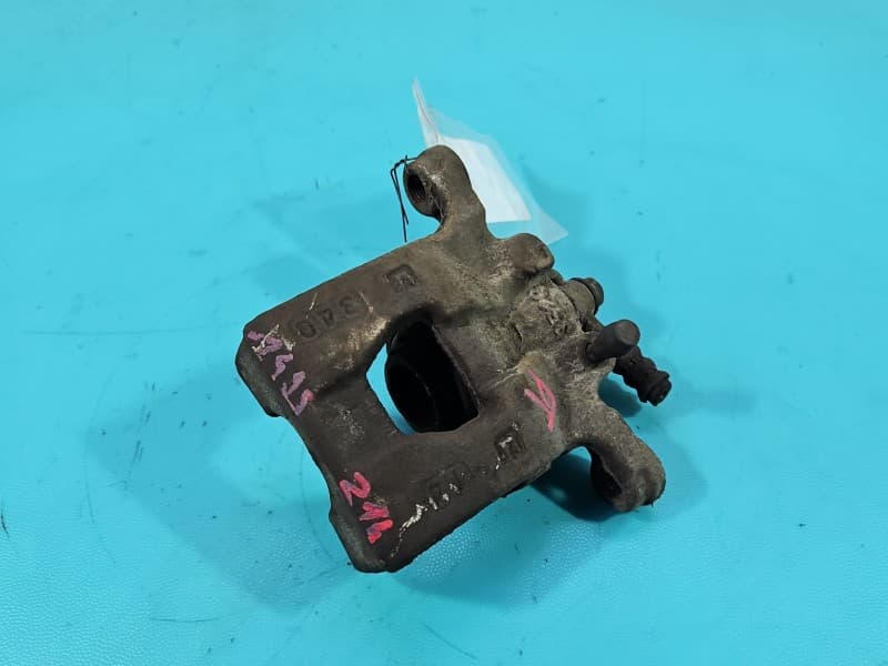 Zacisk tył prawy Nissan Qashqai I J10 06-13 HB 1,6 dci