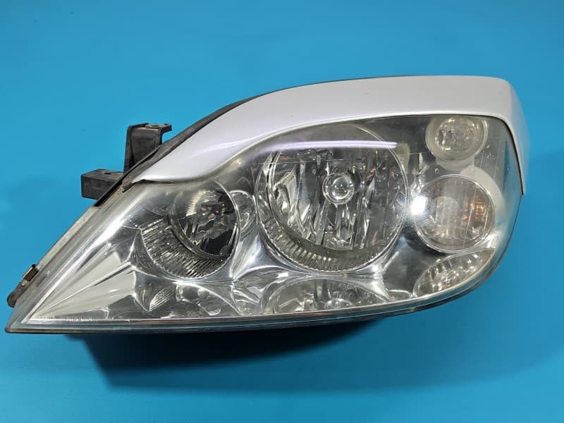 Reflektor lewy lampa przód Nissan Primera P12 EUROPA 1EJ238010-01