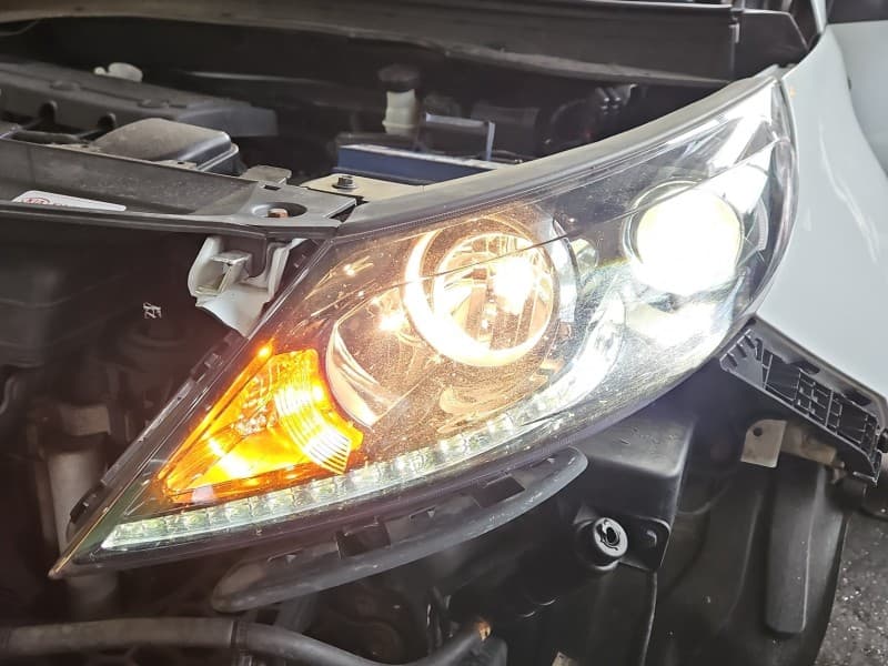Reflektor lewy lampa przód Kia Sportage III 10-15 EUROPA 92101-3WXXX 92101-3UXXX