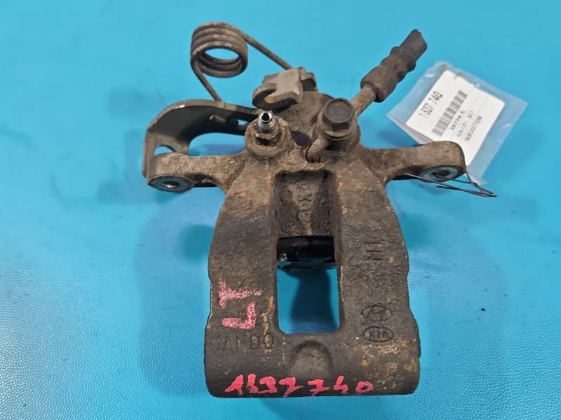 Zacisk tył lewy Kia Rio III 11-14 HB 1,4 16V G4FA
