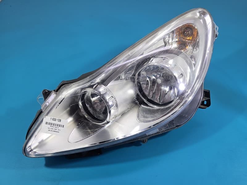 Reflektor lewy lampa przód Opel Corsa D EUROPA