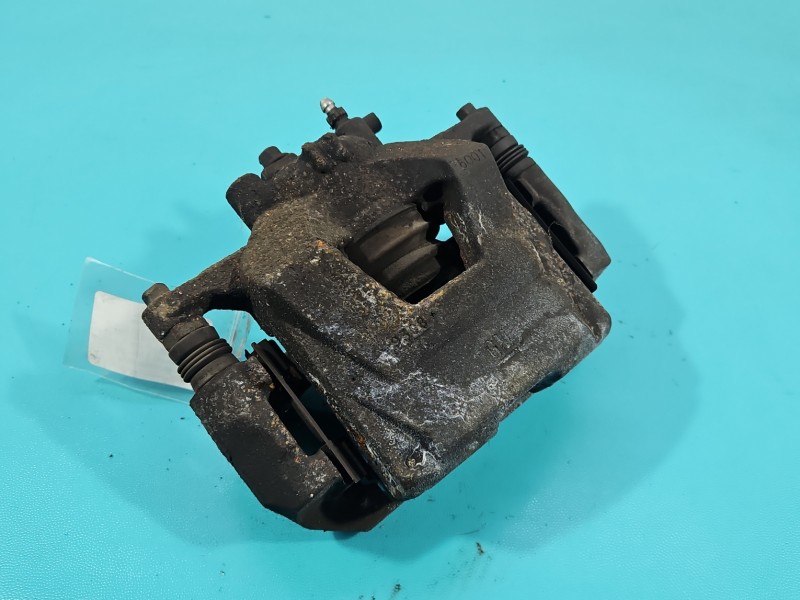 Zacisk przód prawy Opel Astra IV J 1.4 16V