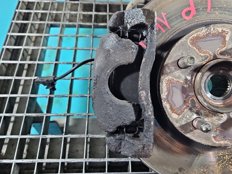 Zacisk przód lewy Nissan Note II E12 1.2 16V