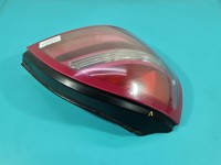 Lampa tył lewa Nissan Almera N16 HB lekko nadpalony otwór na żarówkę porysowana Z LISTWĄ ŻARÓWKOWĄ 00-03 PRZED LIFTEM...