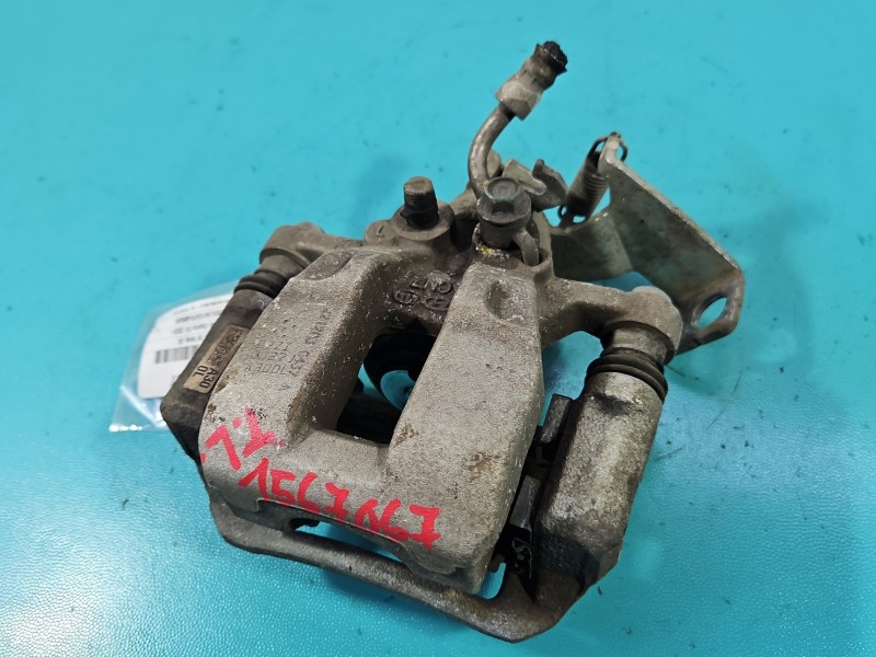Zacisk tył lewy Hyundai Elantra VII 20- sedan 1.6 16V