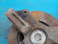 Zacisk tył lewy Mazda Premacy 2.0 ditd HB