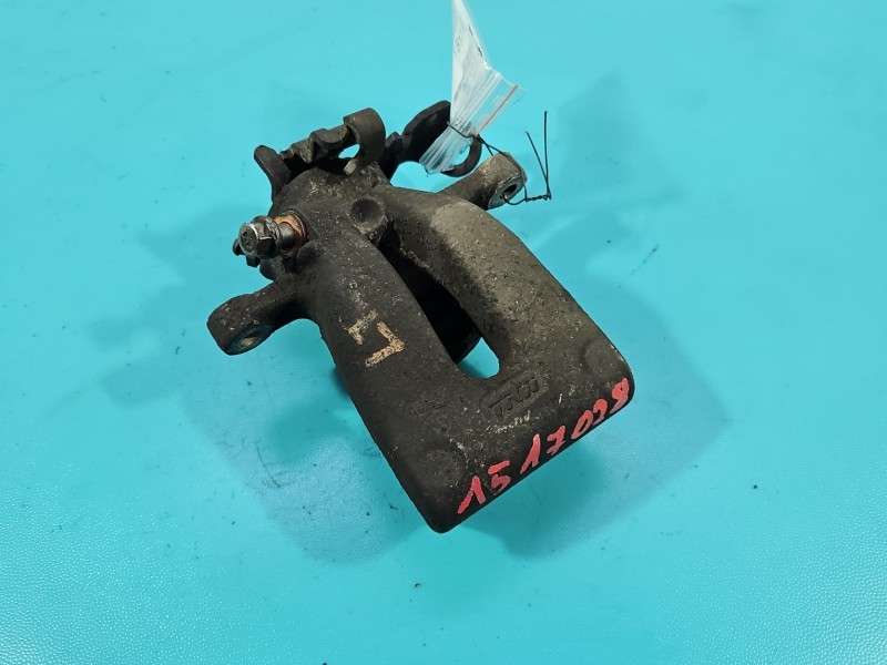 Zacisk tył lewy Opel Zafira B 1.9 cdti HB