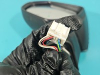 Lusterko lewe Toyota Corolla E21 19- elektryczny, Europejska, Kod lakieru: 040, El. Składane, pęknięta obudowa i uszkodzone...