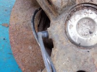 Zacisk tył lewy Mazda Premacy 2.0 ditd HB