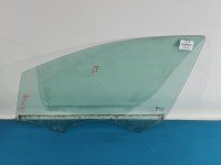 Szyba drzwi przód lewa Opel Astra V K HB