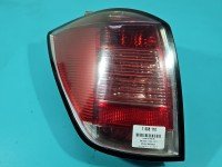 Lampa tył lewa Producent części: OPEL, mikropęknięcia Z LISTWĄ ŻARÓWKOWĄ KOMBI Opel Astra III H kombi