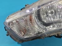 Reflektor lewy lampa przód Mitsubishi Outlander II 06-13 EUROPA