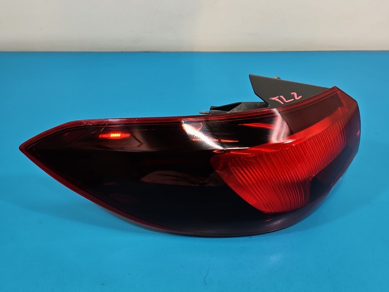 Lampa tył lewa Opel Astra V K kombi EUROPA 39077374