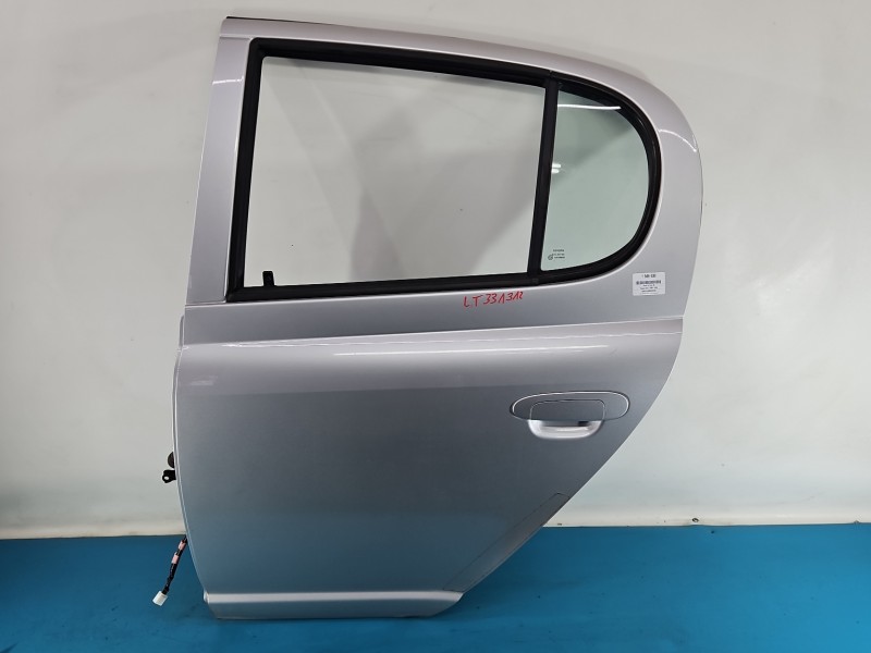 Drzwi tył lewe Toyota Yaris I HB 5d srebrny 1E7