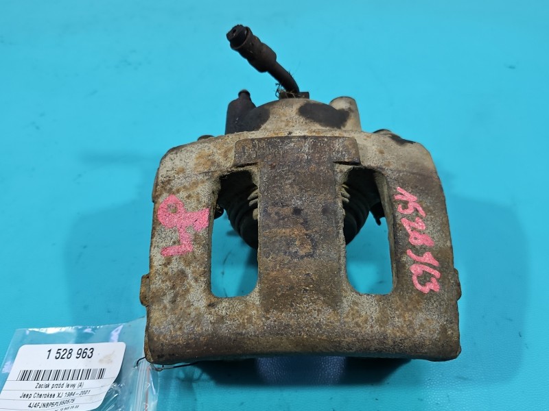 Zacisk przód lewy Jeep Cherokee XJ 2.5b