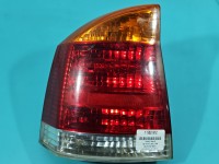 Lampa tył lewa Opel Vectra C sedan Producent części: OPEL, 02-05 POMARAŃCZOWY KIERUNEK SEDAN-HATCHBACK Z LISTWĄ ŻARÓWKOWĄ EUROPA