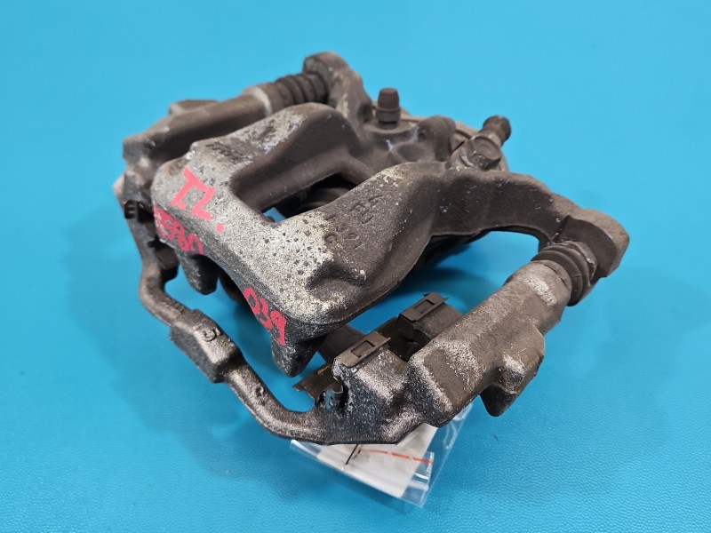 Zacisk tył lewy Toyota Corolla E21 19- sedan 1.8 16V