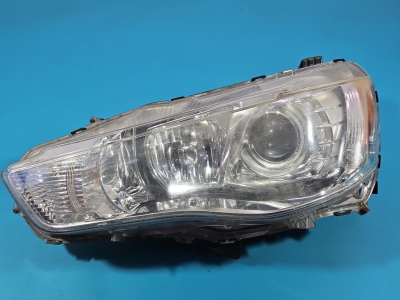 Reflektor lewy lampa przód Mitsubishi Outlander II 06-13 EUROPA