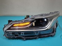 Reflektor lewy lampa przód Toyota Corolla E21 19- EUROPA