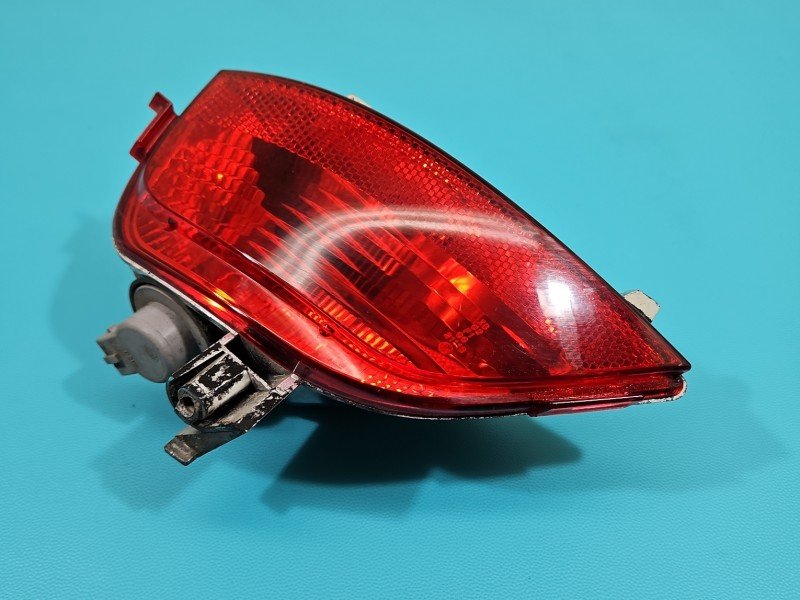 Lampa tył lewa zderzaka przeciwmgielna Dacia Sandero II 12-20 0338900 Lampa tył lewa zderzaka przeciwmgielna Dacia Sandero II 12-20 0338900