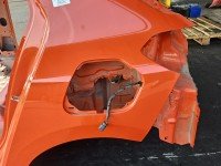 Błotnik tył lewy Opel Corsa F ćwiartka pomarańczowy KVH