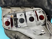 Lampa tył lewa Producent części: OPEL, mikropęknięcia Z LISTWĄ ŻARÓWKOWĄ KOMBI Opel Astra III H kombi