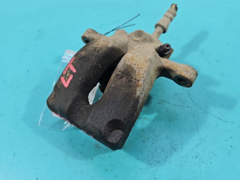 Zacisk tył lewy BMW E87 2.0d HB