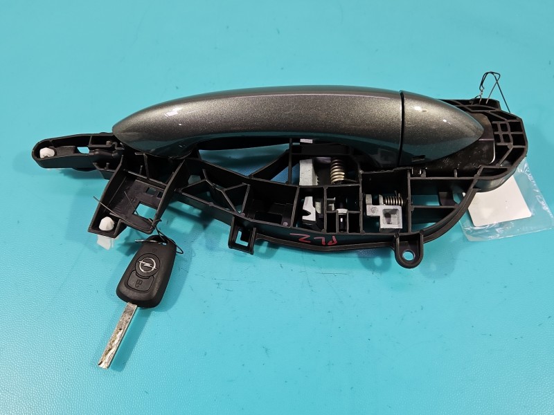 Klamka przód lewa zewnętrzna Opel Astra V K 13515513 Z10a