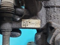 Zacisk tył lewy Opel Astra IV J 1.6 16v HB