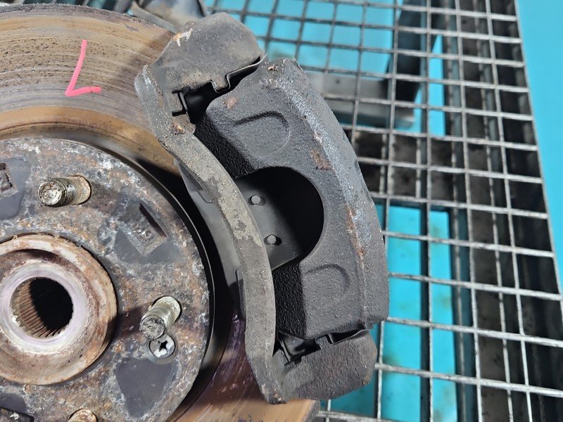 Zacisk przód lewy Hyundai Elantra V 10-16 1.6 GDI (G4FG)