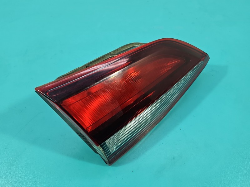 Lampa tył lewa Producent części: OPEL, klapy bagażnika / kombi / z listwą żarówkową Opel Astra V K kombi EUROPA