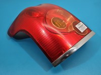 Lampa tył lewa Toyota Avensis II T25 kombi TOYOTA, KOITO 03-06 Urwane mocowanie przy wkładzie lampy EUROPA
