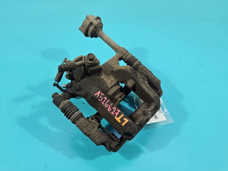 Zacisk tył lewy Opel Astra IV J 1.4 16V HB