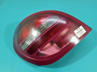 Lampa tył lewa Nissan Almera N16 HB lekko nadpalony otwór na żarówkę porysowana Z LISTWĄ ŻARÓWKOWĄ 00-03 PRZED LIFTEM...