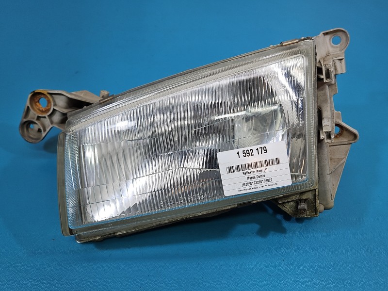 Reflektor lewy lampa przód Mazda Demio EUROPA