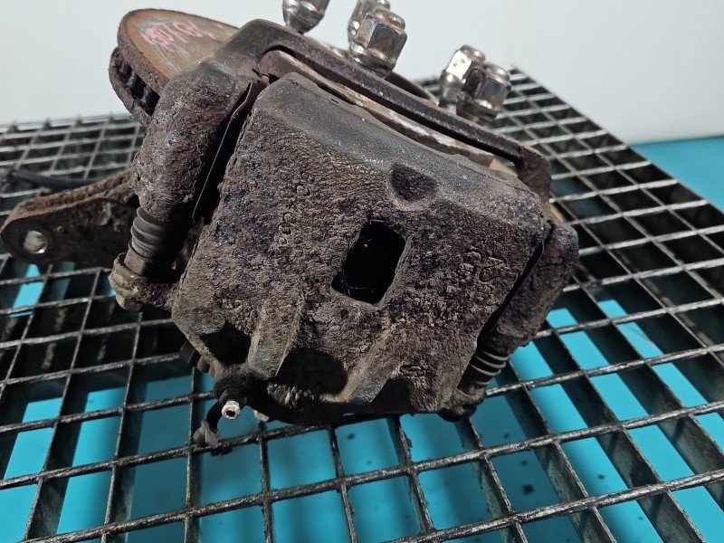 Zacisk przód lewy Kia Sportage II 04-10 2.0 16V