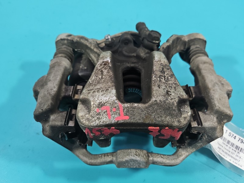 Zacisk tył lewy Toyota Corolla E21 19- sedan 1.5 12V