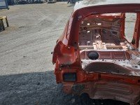 Błotnik tył lewy Opel Corsa F ćwiartka pomarańczowy KVH